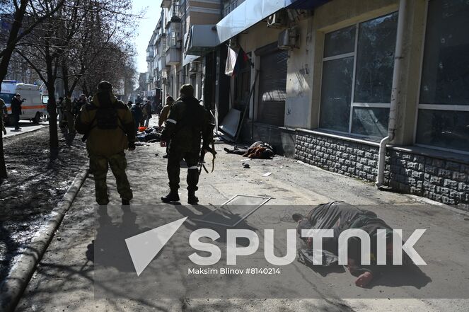 Bodies of killed residents lie in the street after a Ukrainian Tochka-U missile had been shot down near the Government House in the city center in Donetsk, Donetsk People's Republic. The Donetsk authorities reported, according to preliminary data, 20 people died and nine were injured. Location: Donetsk People's Republic, Donetsk. Author: Maksim Blinov/Sputnik. DPR Shelling Aftermath