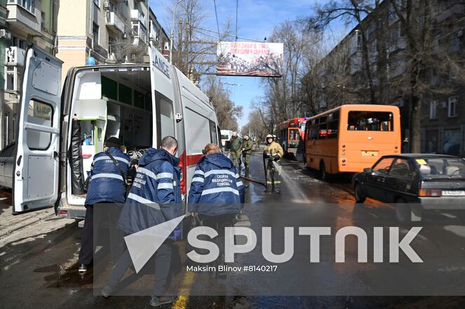 Firefighters and medics are seen in the street after a recent shelling in Donetsk, Donetsk People's Republic. The Donetsk authorities reported a Ukrainian Tochka-U missile had been shot down near the Government House in the city center, according to preliminary data, 20 people died and nine were injured. Location: Donetsk People's Republic, Donetsk. Author: Maksim Blinov/Sputnik. DPR Shelling Aftermath