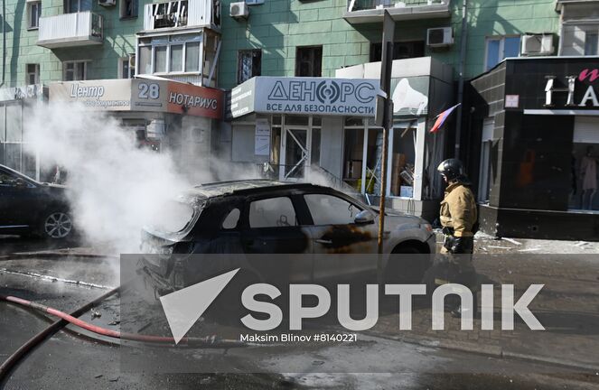 Firefighters extinguish a burning car after a recent shelling in Donetsk, Donetsk People's Republic. The Donetsk authorities reported a Ukrainian Tochka-U missile had been shot down near the Government House in the city center, according to preliminary data, 20 people died and nine were injured. Location: Donetsk People's Republic, Donetsk. Author: Maksim Blinov/Sputnik. DPR Shelling Aftermath