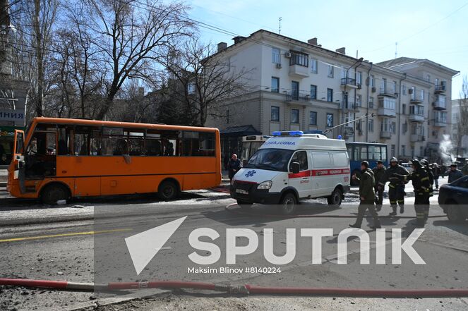 An ambulance moves in the street after a recent shelling in Donetsk, Donetsk People's Republic. The Donetsk authorities reported a Ukrainian Tochka-U missile had been shot down near the Government House in the city center, according to preliminary data, 20 people died and nine were injured. Location: Donetsk People's Republic, Donetsk. Author: Maksim Blinov/Sputnik. DPR Shelling Aftermath
