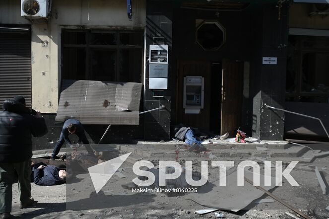 Bodies of killed residents lie in the street after a Ukrainian Tochka-U missile had been shot down near the Government House in the city center in Donetsk, Donetsk People's Republic. The Donetsk authorities reported, according to preliminary data, 20 people died and nine were injured. Location: Donetsk People's Republic, Donetsk. Author: Maksim Blinov/Sputnik. DPR Shelling Aftermath
