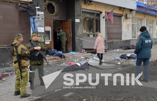 Bodies of killed residents lie in the street after a Ukrainian Tochka-U missile had been shot down near the Government House in the city center in Donetsk, Donetsk People's Republic. The Donetsk authorities reported, according to preliminary data, 20 people died and nine were injured. Location: Donetsk People's Republic, Donetsk. Author: Alexey Kudenko/Sputnik. DPR Shelling Aftermath