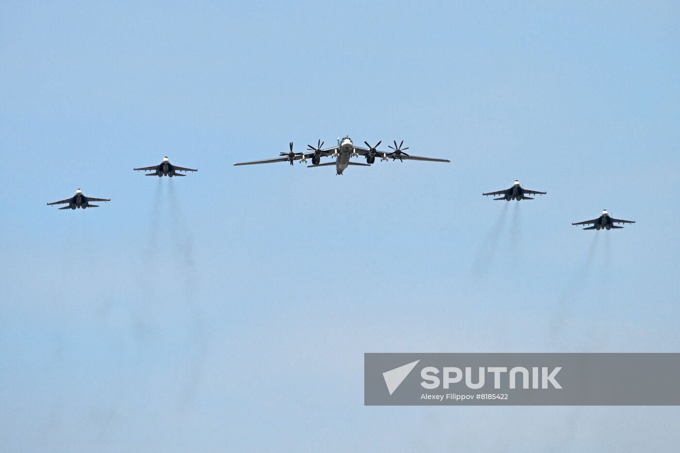 Sukhoi Su-35S fighter jets and the Tupolev Tu-95MS strategic heavy bomber fly during a dress rehearsal of a military parade marking the 77th anniversary of the victory over Nazi Germany in World War II, in Moscow, Russia. Location: Russia, Moscow. Author: Alexey Filippov/Sputnik. Russia WWII Victory Parade Rehearsal
