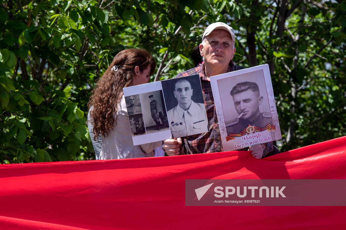 People hold photographs of their relatives who fought against Nazi Germany in WWII attend the Immortal Regiment march marking the 77th anniversary of the victory in World War II, in Yerevan, Armenia. Location: Armenia, Yerevan. Author: Aram Nersesyan/Sputnik/РИА Новости. Worldwide WWII Immortal Regiment March