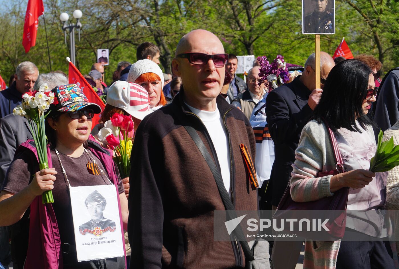 Participants of Immortal Regiment march are pictured during the Victory Day celebrations marking the 77th anniversary of the victory over Nazi Germany in World War II, in Kherson, Ukraine. Location: Ukraine, Kherson. Author: Ivan Rodionov/Sputnik. Ukraine WWII Victory Day Celebrations