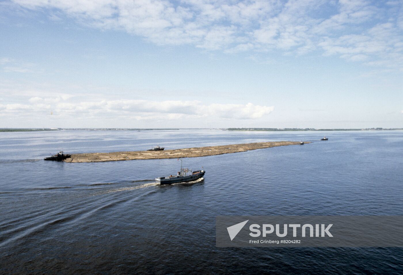 Floating timber rafts down Severnaya Dvina River