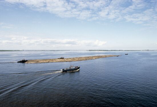 Floating timber rafts down Severnaya Dvina River