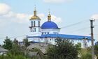 A view shows a church of St. George damaged by shelling in the course of Russia's military operation in the settlement of Komishuvakha, Luhansk People's Republic. Location: Luhansk People's Republic. Author: Viktor Antonyuk/Sputnik. LPR Russia Ukraine Military Operation