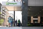 People walk past the Holiday Inn hotel on Lesnaya street in Moscow, Russia. The British company InterContinental Hotels Group (IHG), which owns the Holiday Inn and Crowne Plaza hotel chains, ceases its activities in Russia. Location: Russia, Moscow. Author: Pavel Bednyakov/Sputnik. Russia Economic Sanctions