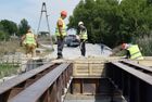 Workers reconstruct a bridge over the Krynka River on the Donetsk-Luhansk highway near the village of Nizhnyaya Krynka, in the Donetsk People's Republic. Location: Donetsk People's Republic. Author: Sergey Baturin/Sputnik. DPR Russia Ukraine Military Operation Bridge Reconstruction
