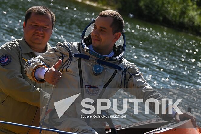 Russian cosmonaut Oleg Platonov, right, crew member of the 70th expedition to the International Space Station, practices an emergency landing in water at Russia's Emergency Ministry base in Noginsk, Moscow region, Russia. Location: Russia, Moscow region. Author: Evgeny Odinokov/Sputnik. Russia Space