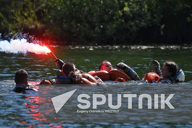 Russian cosmonauts Alexey Ovchinin and Oleg Platonov and NASA astronaut Tracy Caldwell Dyson, crew members of the 70th expedition to the International Space Station, practice an emergency landing in water at Russia's Emergency Ministry base in Noginsk, Moscow region, Russia. Location: Russia, Moscow region. Author: Evgeny Odinokov/Sputnik. Russia Space