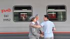 Conductors are seen in front of the Belarusian Voyage tourist train at Belorussky railway station in Moscow, Russia. The first tourist train departed from Moscow to Belarus on August 5 on two routes through the cities Brest or Grodno and Minsk. In two-day trip tourists will be able to walk and explore the sights and return to Russian capital. Location: Russia, Moscow. Author: Evgeny Biyatov/Sputnik. Russia Belarus Tourist Train