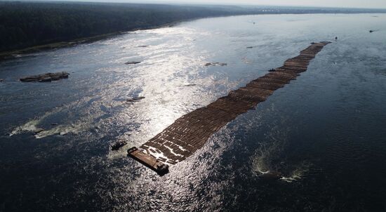 Log rafts drift down Angara River