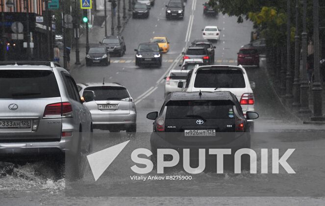 Cars ride on the road during the rain in Vladivostok, Russia. Due to the lack of storm sewers, the roads are flooded with water. Location: Russia, Vladivostok. Author: Vitaliy Ankov/Sputnik. Russia Weather
