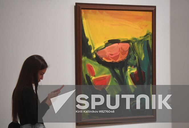 A visitor stands at the painting "Flowers and Yellow Sky" (2002) by the artist Irina Starzhenetskaya at the exhibition "My Tretyakov Gallery. From Virtuality to Reality" in the New Tretyakov Gallery on Krymsky Val street in Moscow, Russia. The new exhibition project combines the display of works of art and a demonstration of the capabilities of a digital platform that allowes you to get acquainted with the museum's funds online. At the moment, there are more than 4 thousand works of art stored in the Tretyakov Gallery in the public domain. Location: Russia, Moscow. Author: Kirill Kallinikov/Sputnik. Russia Art Tretyakov Gallery Collection