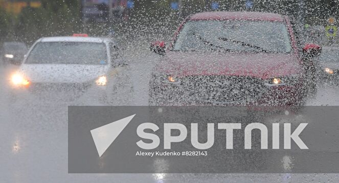 Cars pass through puddles during heavy rain in Moscow, Russia. Location: Russia, Moscow. Author: Alexey Kudenko/Sputnik. Russia Weather