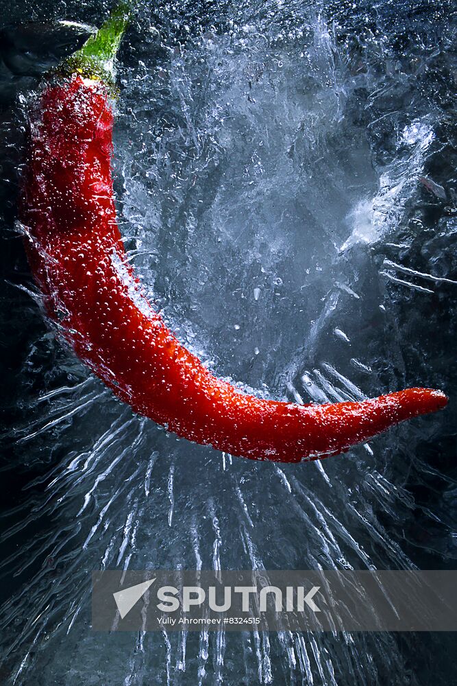 High-resolution photos of pepper frozen in water