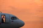 A plane is seen at Domodedovo Airport during sunset, outside Moscow, Russia. Location: Russia, Moscow region. Author: Kirill Kallinikov. Russia Airlines
