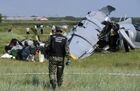 A Russian Investigative Committee officer walks at the site, where the twin-engine L-410 plane crashed near the Tanay aerodrome, which provides parachuting services, leaving four people dead, in Kemerovo region, Russia. Five survivors of the plane crash are in intensive care units with critical injuries, while the condition of eight others is assessed as stable. It was a training flight with 17 skydivers and two experienced crew members. Location: Russia, Kemerovo region. Author: Alexandr Kryazhev. Russia Plane Crash
