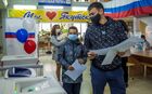 A man prepares to cast his ballot at a polling station in Yakutsk, Russia. Russia holds legislative elections on 17-19 September 2021. Voters will elect members of the Russian State Duma and heads of nine Russian regions and 39 constituent regions. Location: Russia, Republic of Sakha (Yakutia), Yakutsk. Author: Andrey Sorokin/Sputnik. Russia Parliamentary Elections