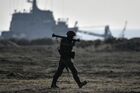 A Russian serviceman takes part in an amphibious assault exercise along the coast held by army corps and naval infantry units of the Russian Black Sea Fleet at the Opuk training ground near Kerch, Crimea, Russia. Location: Republic of Crimea. Author: Konstantin Mihalchevskiy/Sputnik. Russia Crimea Military Drills