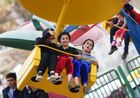 People are seen while riding the carousel, in Dushanbe, Tajikistan. Location: Tajikistan, Dushanbe. Author: Pavel Bednyakov/Sputnik. Tajikistan Daily Life