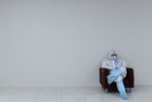 A medical staff member is seen at a temporary hospital for people suffering from the coronavirus disease at the Moskva car center in Moscow, Russia. Location: Moscow. Author: Alexey Maishev/Sputnik. Russia Coronavirus Treatment