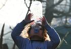 A girl drinks water in an illegal migrant camp on the Belarusian-Polish border in Grodno region, Belarus. Hundreds if not thousands of migrants from the Middle East and North Africa tried to storm the border from Belarus into Poland, cutting razor wire defenses and using branches to try and climb over fences. Polish authorities regarded this as "the largest attempt of mass forceful penetration" and strengthened border security. Location: Belarus, Grodno Region. Author: Viktor Tolochko/Sputnik/РИА Новости. Belarus Poland Border Refugees