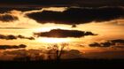 Trees are silhouetted against the setting sun in forest-steppe in the Ordzhonikidze district, Republic of Khakassia, Russia. Location: Russia, Republic of Khakassia. Author: Ilya Naymushin/Sputnik. Russia Siberia Tourism