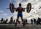 An athlete competes in the all-Russian strongman "Humans Are Stronger Than Vehicles" contest, at Yuzhny Airfield in the city of Sevastopol, Crimea, Russia. Location: Russia, Republic of Crimea, Sevastopol. Author: Konstantin Mihalchevskiy/Sputnik. Russia Strongman Contest