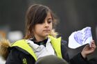 A refugee girl holds a paper with an image of a broken heart at the Bruzgi logistics centre providing accommodation to migrants near the Bruzgi-Kuznica Bialostocka border crossing at the Belarusian-Polish border in Grodno region, Belarus. Migrants from the Middle East and North Africa trapped in Belarus have converged on the border with Poland, where razor wire fences and Polish troops have repeatedly blocked their entry. Location: Belarus, Grodno Region. Author: Pavel Bednyakov/Sputnik. Belarus Poland Border Refugees