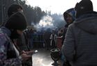 Refugees queue to receive hot meals at the Bruzgi logistics centre providing accommodation to migrants near the Bruzgi-Kuznica Bialostocka border crossing at the Belarusian-Polish border in Grodno region, Belarus. Migrants from the Middle East and North Africa trapped in Belarus have converged on the border with Poland, where razor wire fences and Polish troops have repeatedly blocked their entry. Location: Belarus, Grodno Region. Author: Pavel Bednyakov/Sputnik. Belarus Poland Border Refugees