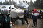 Refugees queue to receive hot meals at the Bruzgi logistics centre providing accommodation to migrants near the Bruzgi-Kuznica Bialostocka border crossing at the Belarusian-Polish border in Grodno region, Belarus. Migrants from the Middle East and North Africa trapped in Belarus have converged on the border with Poland, where razor wire fences and Polish troops have repeatedly blocked their entry. Location: Belarus, Grodno Region. Author: Pavel Bednyakov/Sputnik. Belarus Poland Border Refugees