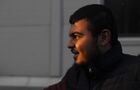 A refugee man is seen at the Bruzgi logistics centre providing accommodation to migrants near the Bruzgi-Kuznica Bialostocka border crossing at the Belarusian-Polish border in Grodno region, Belarus. Migrants from the Middle East and North Africa trapped in Belarus have converged on the border with Poland, where razor wire fences and Polish troops have repeatedly blocked their entry. Location: Belarus, Grodno Region. Author: Pavel Bednyakov/Sputnik. Belarus Poland Border Refugees
