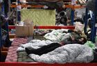 Refugees are seen at the Bruzgi logistics centre providing accommodation to migrants near the Bruzgi-Kuznica Bialostocka border crossing at the Belarusian-Polish border in Grodno region, Belarus. Migrants from the Middle East and North Africa trapped in Belarus have converged on the border with Poland, where razor wire fences and Polish troops have repeatedly blocked their entry. Location: Belarus, Grodno Region. Author: Pavel Bednyakov/Sputnik. Belarus Poland Border Refugees