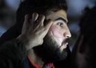 A refugee has his beard cut at the Bruzgi logistics centre providing accommodation to migrants near the Bruzgi-Kuznica Bialostocka border crossing at the Belarusian-Polish border in Grodno region, Belarus. Migrants from the Middle East and North Africa trapped in Belarus have converged on the border with Poland, where razor wire fences and Polish troops have repeatedly blocked their entry. Location: Belarus, Grodno Region. Author: Pavel Bednyakov/Sputnik. Belarus Poland Border Refugees