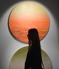 A visitor explores "Grandfather's fairy tales" exhibition of artist Vladimir Dubossarsky at a private gallery, in Moscow, Russia. Location: Russia, Moscow. Author: Kirill Kallinikov/Sputnik. Russia Modern Art