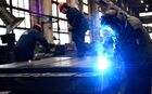Employees work in a machine shop at the Nizhneturinsky Machine-Building Plant, a separate division of the Ural-Siberian Industrial Company, in the city of Nizhnyaya Tura, Sverdlovsk region, Russia. The Company manufactures high-tech drilling rigs for operational and exploratory drilling. Location: Sverdlovsk Oblast Region. Author: Pavel Lisitsyn/Sputnik. Russia Mechanical Engineering Industry