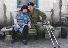 Ataman of the village of Kirovskaya Olexandr Ogirin is pictured during a meeting with his mother Olga Ogirina in eight years being away, in the village of Muratovo, Luhansk People's Republic. Alexander lost his leg as a result of injury while serving in the LPR People's Militia. Location: Luhansk People's Republic, Luhansk Region. Author: Valery Melnikov/Sputnik. LPR Family Reunion