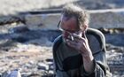 An elderly man smokes on the ashes of his house burned as a result of a large fire during a storm wind on May 7, in the city of Uyar, Krasnoyarsk region, Russia. According to official data, 827 buildings burned down in Krasnoyarsk region on May 7, including 518 residential buildings in 60 settlements, 8 people were killed. Location: Russia, Krasnodar region. Author: Ilya Naymushin/Sputnik. Russia Wildfires