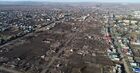 The aerial view shows a burnt - out settlement as a result of a large fire during a storm wind on May 7, in the city of Uyar, Krasnoyarsk region, Russia. According to official data, 827 buildings burned down in Krasnoyarsk region on May 7, including 518 residential buildings in 60 settlements, 8 people were killed. Location: Russia, Krasnodar region. Author: Ilya Naymushin/Sputnik. Russia Wildfires