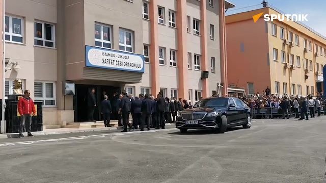 Erdogan with reporters after casting his ballot 
