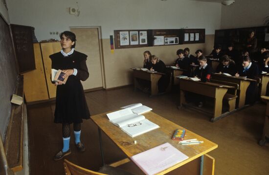 Zapyskis Collective Farm agriculturist's daughter during mathematics class