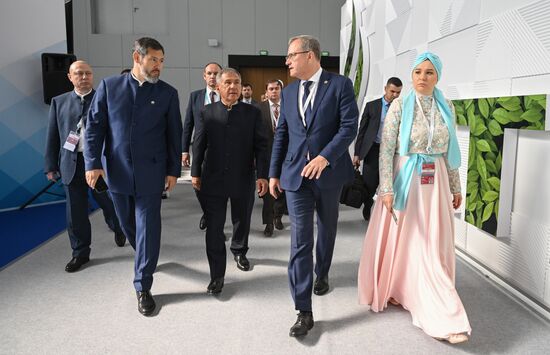 Head of the Republic of Tatarstan Rustam Minnikhanov, front second left, at the 14th Russia - Islamic World: KazanForum International Economic Forum. Left: Oleg Korobchenko, Deputy Prime Minister and Minister of Industry and Trade of Tatarstan. Right: Taliya Minullina, Director of the Tatarstan Investment Development Agency. Crediting the source is mandatory when using the photo. Location: Russia, Republic of Tatarstan, Kazan. Author: Svetlana Shevchenko/ANO “Directorate for Sports and Social Projects”. Head of Republic of Tatarstan Rustam Minnikhanov visits KAZANFORUM 2023