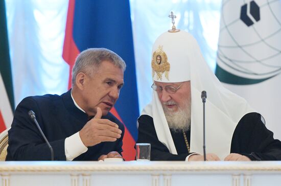 From left: Rustam Minnikhanov, Rais of the Republic of Tatarstan, Chairperson of the Russia – Islamic World Strategic Vision Group, and Patriarch Kirill of Moscow and All Russia. Russia-Islamic World Strategic Vision Group, a session during the 14th Russia - Islamic World: KazanForum international economic forum. Photos may be used subject to the terms in the forum-specific section of the media bank. Location: Russia, Republic of Tatarstan, Kazan. Author: Pavel Lisitsyn/ANO “Directorate for Sports and Social Projects”. KAZANFORUM 2023. Russia-Islamic World Strategic Vision Group