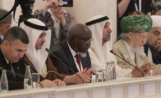 Center: Ahmad Kavesa Sengendo, OIC Deputy Secretary General for Economic Cooperation, Uganda. Russia-Islamic World Strategic Vision Group, a session during the 14th Russia - Islamic World: KazanForum international economic forum. Photos may be used subject to the terms in the forum-specific section of the media bank. Location: Russia, Republic of Tatarstan, Kazan. Author: Pavel Lisitsyn/ANO “Directorate for Sports and Social Projects”. KAZANFORUM 2023. Russia-Islamic World Strategic Vision Group