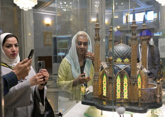 Guests of the forum take pictures of the model of the Kul Sharif Mosque on the ground floor of the Kul Sharif Mosque in the Kazan Kremlin State Historical, Architectural and Art Museum Reserve during a sightseeing tour of the city. Photos may be used as stated in the media bank section concerning the forum. Location: Russia, Republic of Tatarstan, Kazan. Author: Alexandr Kryazhev/ANO “Directorate for Sports and Social Projects”. KAZANFORUM 2023. Sightseeing tour of Kazan