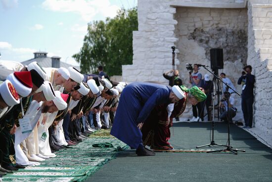 Supreme mufti of Russia and Chair of the Central Spiritual Board of Russia's Muslims Talgat Tajuddin, right, background, during a collective prayer during the Izge Bolgar Zhyeny festival held as part of the 14th International Russia — Islamic World Economic Forum. Photos may be used subject to the terms in the forum-specific section of the media bank. Location: Russia, Republic of Tatarstan, Bolgar. Author: Alexei Danichev/ANO “Directorate for Sports and Social Projects”. KAZANFORUM 2023. Izge Bolgar Zhyeny Festival