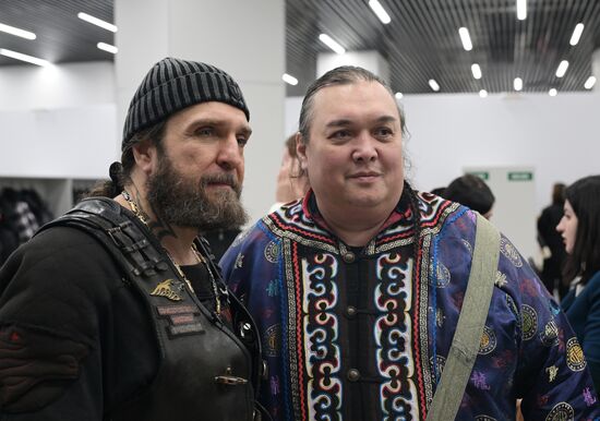 RUSSIA EXPO. From left: Night Wolves bikers' club president Alexander 'Surgeon' Zaldastanov, Leonid Sungorkin, founder and editor-in-chief of Post Khabarovka and Aborigen, President of the Association for the Protection of the Culture, Rights and Freedoms of Amur Indigenous Peoples. Location: Russia, Moscow. Author: Vladimir Astapkovich/Sputnik. Night Wolves bikers' club president Alexander 'Surgeon' Zaldastanov visits RUSSIA EXPO